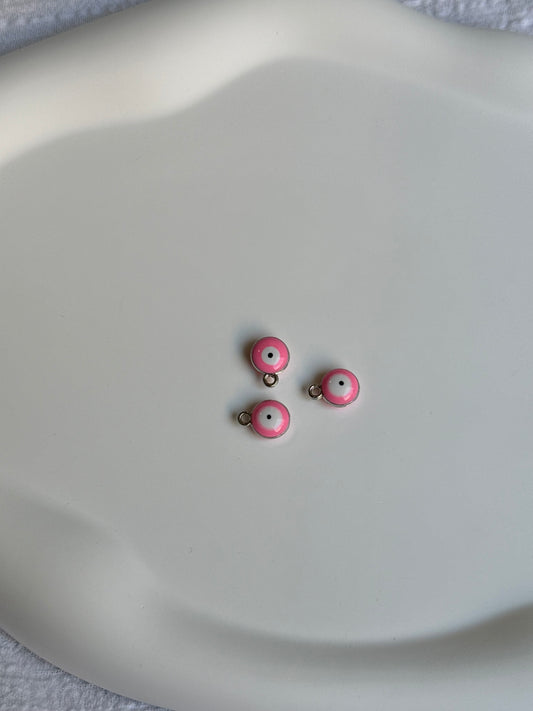 Breloque œil rose