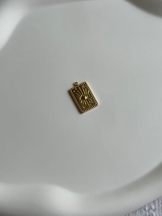 Breloque œil strass doré